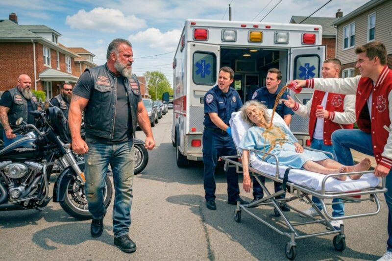 Bullies Blocked an Old Lady’s Ambulance and Laughed as Every Second Became More Desperate — But They Had No Idea Her Son Was the Hells Angels Boss Already Racing Across Town, Losing Patience With Every Missed Call, Until the Road Fell Silent, Engines Roared In From Every Direction, and a Cruel Little Standoff Turned Into the Kind of Small-Town Reckoning No One Could Ignore, Leaving Witnesses Stunned, the Bullies Pale, and Everyone Asking Why Anyone Would Ever Dare Stand Between a Mother, an Ambulance, and the One Man Everyone Knew Not to Cross
