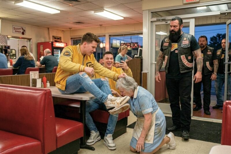 “Lick It!” the Cruel Bullies Laughed as They Humiliated an Elderly Waitress in the Middle of the Diner, Forcing Her Down While Everyone Looked Away — But They Had No Idea the Quiet Woman They Mocked Was the Mother of a Feared Hells Angels Boss, and When Her Son Walked Through the Door, the Entire Room Fell Silent as Their Arrogance Turned Into Instant Regret